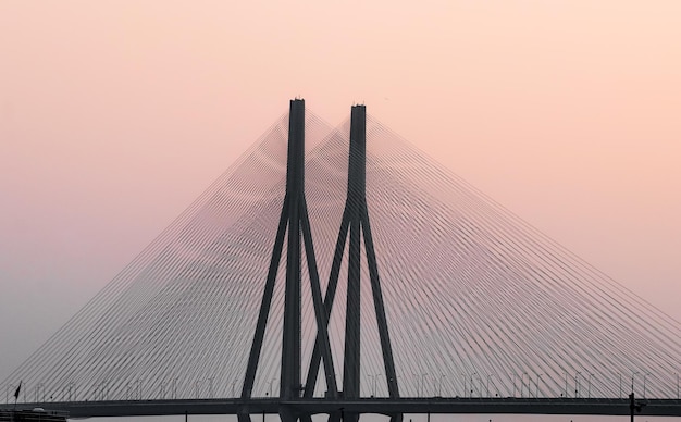 Stunning Low Angle View of Suspension Bridge at Sunset – Free Download