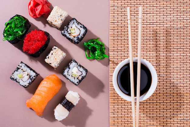 Sushi Rolls with Soy Sauce and Chopsticks – Free Download