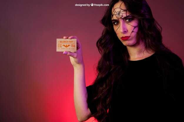 Halloween Mockup Featuring a Girl Holding a Card – Free Download