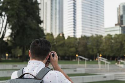 Back View of a Young Man Taking a Picture – Free Download