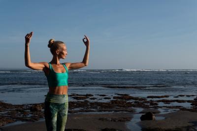 Beautiful Woman Practicing Yoga on the Beach – Free Download