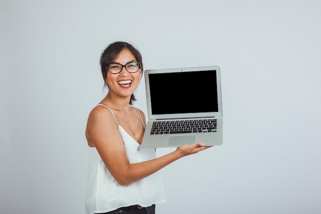 Laughing Young Woman with Laptop – Free Stock Photo for Download