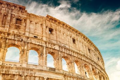 Colosseum Against the Sky in Rome, Italy – Famous Travel Destination for Free Download