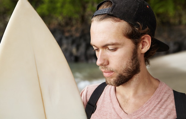 Serious and Concentrated Young Bearded Pro Surfer Preparing for a Contest – Free Stock Photo Download