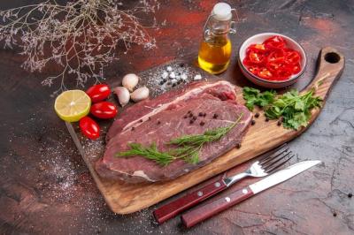 Red Meat on Wooden Cutting Board with Garlic, Lemon, and Vegetables – Free Download