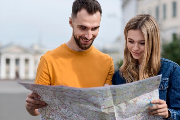 Young Friends Exploring a Map – Free Stock Photo, Download for Free