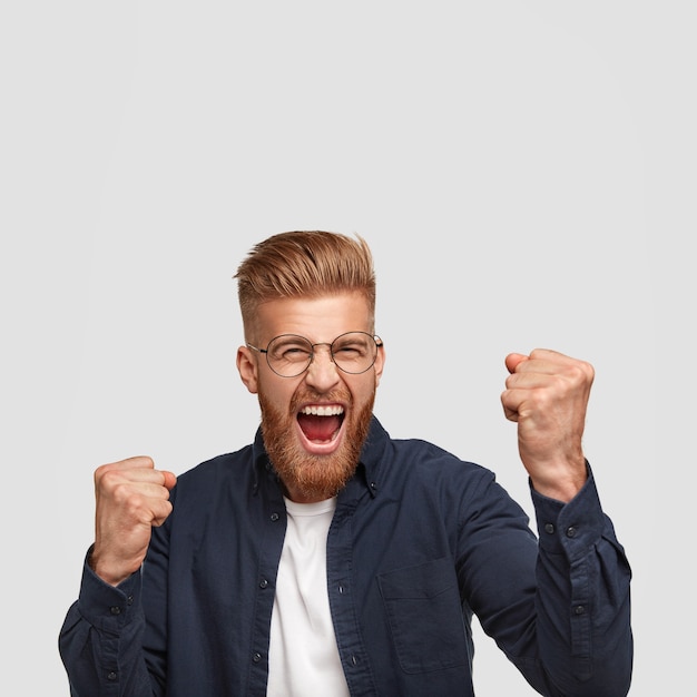 Positive Ginger Male Celebrating Success – Free Stock Photo Download