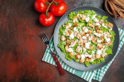 Caesar Salad on Oval Plate with Tomatoes – Free Stock Photo for Download