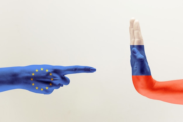 Confrontation: Symbolism of Political Discord with European and Russian Flags – Free Download