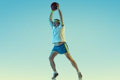 Senior Man Playing Basketball in Neon Light – Free Stock Photo for Download