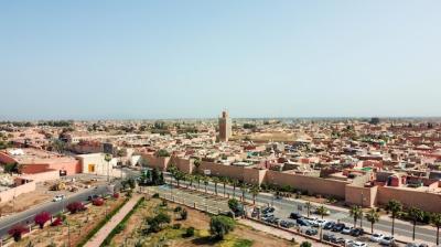 Aerial Drone View of Downtown Marrakesh, Morocco Featuring Ben Youssef Mosque – Free Download