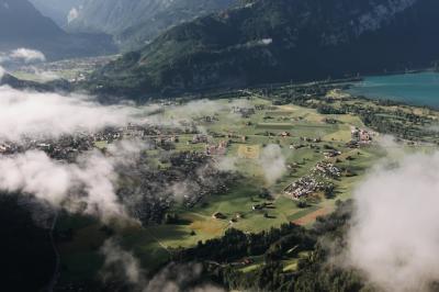 Stunning Aerial View of a Foggy Mountain Town – Free Download