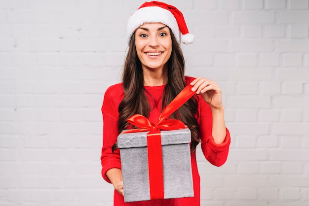 Happy Young Lady Holding a Present Box – Free Stock Photo for Download