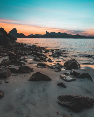 Stunning Rocky Coast at Sunset with Vibrant Blue Sky – Free Stock Photo | Download for Free