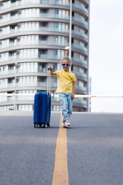 Cute Young Girl with Suitcase Luggage Outdoors – Free Download