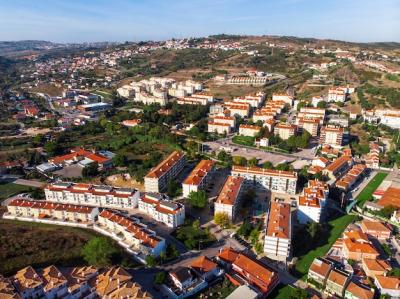 Charming Streets of Alhandra in Portugal Surrounded by Trees – Free Download