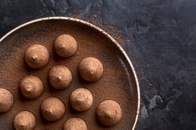 Top View of a Plate Featuring Chocolate Candy and Cocoa Powder – Free to Download