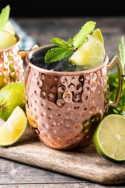 Moscow Mule Cocktail with Ice and Lime Slice on Wooden Table – Free Download