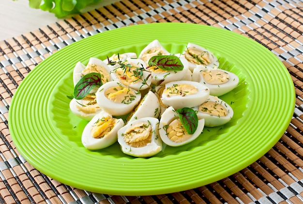 Boiled Quail Egg Halves on a Green Plate – Free Download