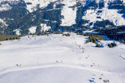 Aerial Shot of a Ski Resort on a Snowy Mountain – Free Stock Photo for Download