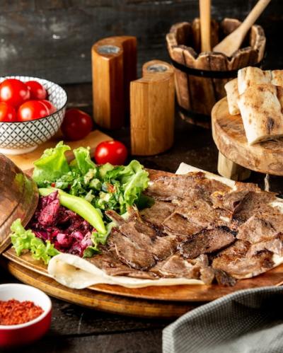 Lamb Doner Slices with Vegetable Salad and Flatbread – Free Download