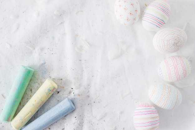 Patterned Easter Eggs Surrounded by Quills and Chalks – Free Download