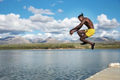 Man Jumping in Lake – Free Stock Photo for Download