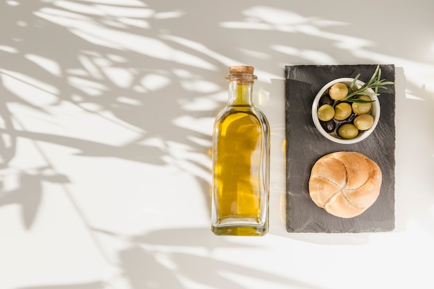 Bun and Olives in Bowl with Oil Bottle – Free to Download