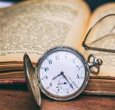Pocket Watch and Old Books on a Wooden Office Desk Background – Free Download