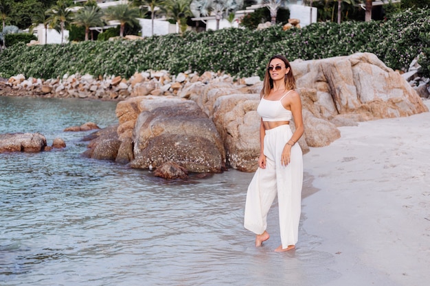 Young Calm Happy Caucasian Woman on Tropical Beach at Sunset – Free Download