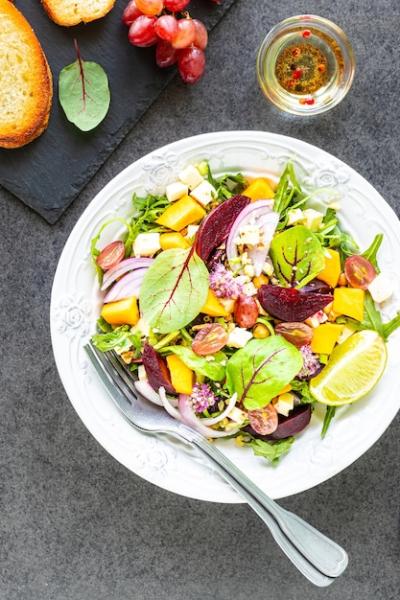 Fresh Vegetable Salad with Beets, Arugula, Red Onion, and Sorrel on a White Plate â Free Stock Photo for Download