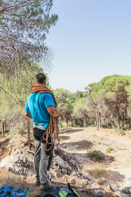 Climber with Rope Standing on Rock – Free Download