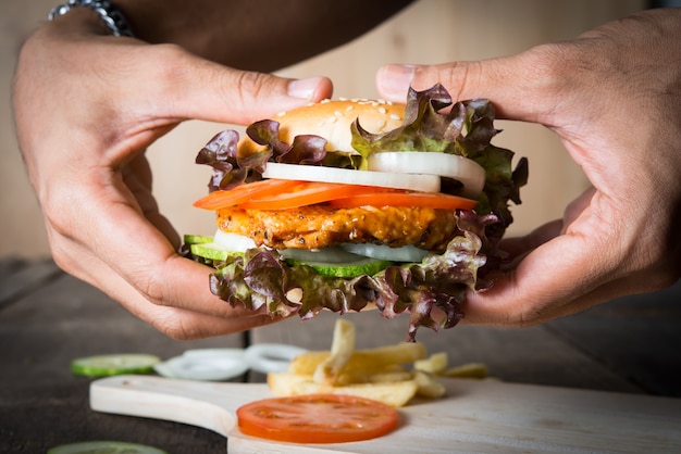 Delicious Burger and Potato Chip in Hand – Free Stock Photo, Download Free