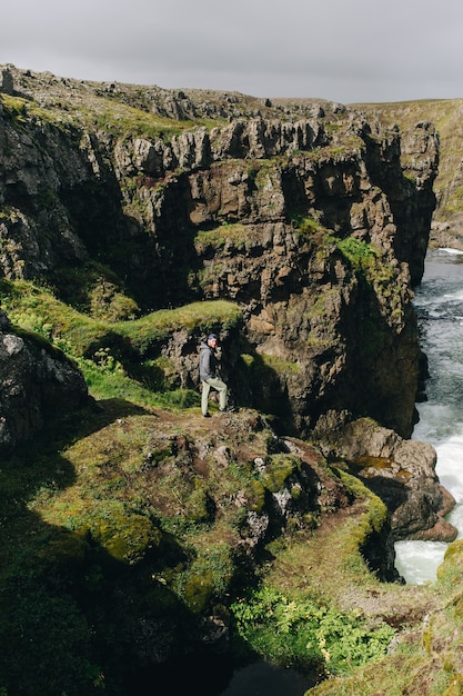 Man Traveler Exploring Icelandic Landscape – Free Download