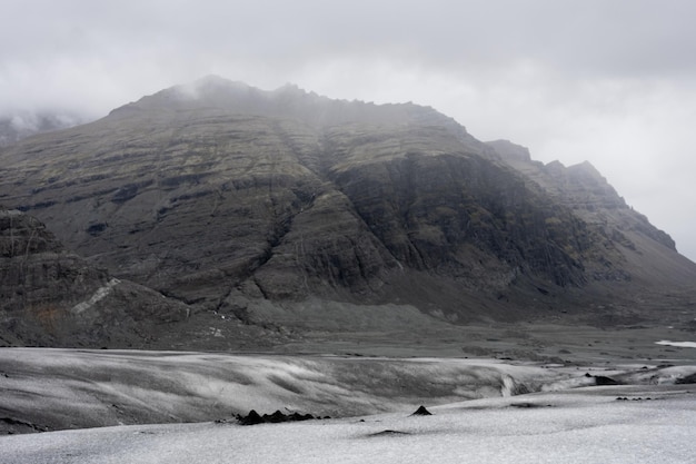 Stunning Mountain Range Shrouded in Clouds – Free Download