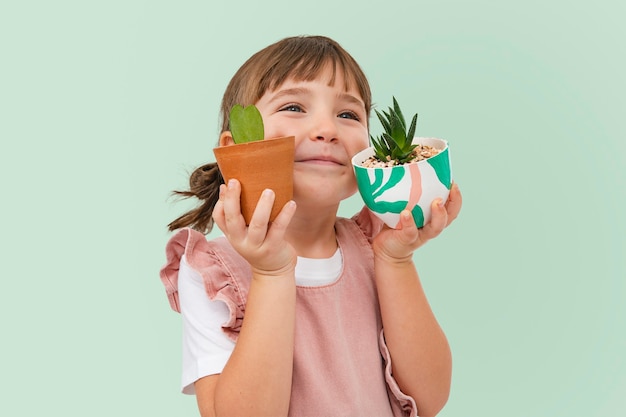 Cute Girl with Plants – Studio Shoot Free Stock Photo for Download