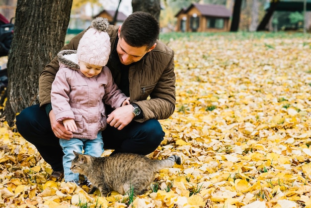 Daughter and Dad Enjoying Autumn Park with Their Cat – Free Stock Photo for Download