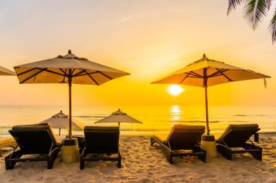 Beautiful Beach and Sea at Sunrise: Umbrella and Chair for Travel and Vacation – Free Download