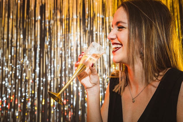 Happy Woman Drinking Champagne at New Year Celebrations – Free Download