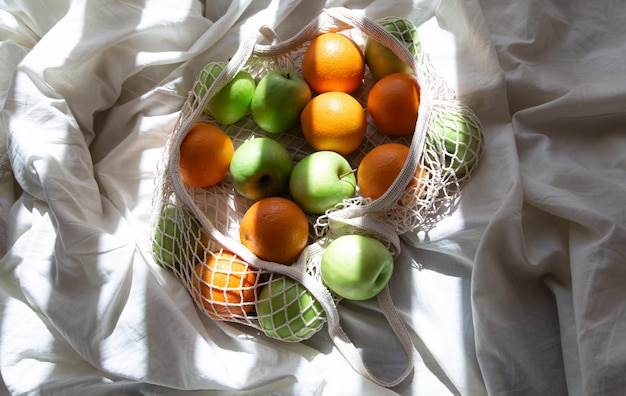 String Bag Filled with Fruits Amid Sunbeams – Free Stock Photo Download