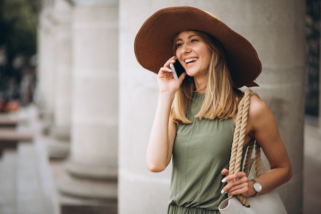 Woman in Hat on Vacation Talking on the Phone – Free Download