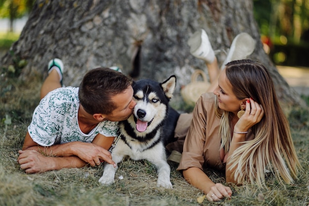 Young Couple with a Husky – Free Download