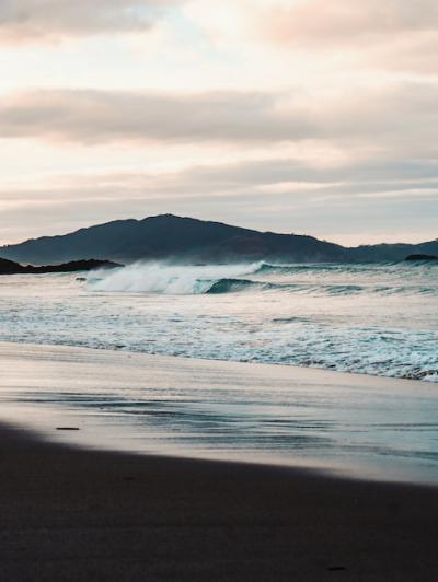 Beautiful Sea Waves on the Beach with Mountains – Free Stock Photo for Download