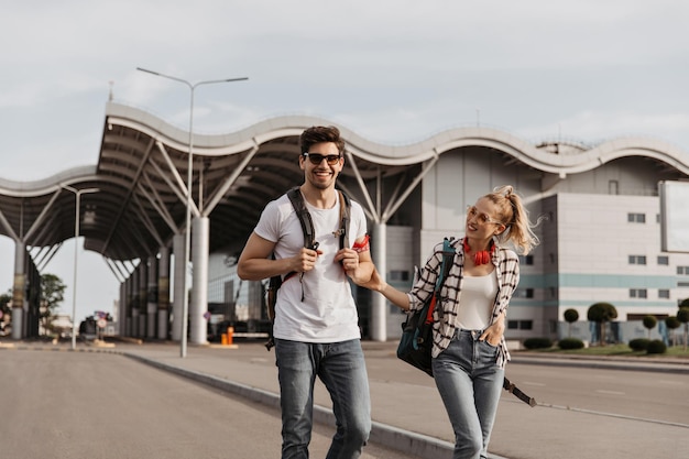 Brunette Man and Girl in Plaid Shirt Smiling While Traveling | Free Stock Photo Download