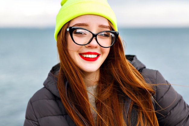 Cheerful Woman with Red Hair Enjoying the Beach in Winter – Free Stock Photo for Download