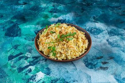 Delicious Homemade Noodles in a Bowl on a Blue Background – Free Download