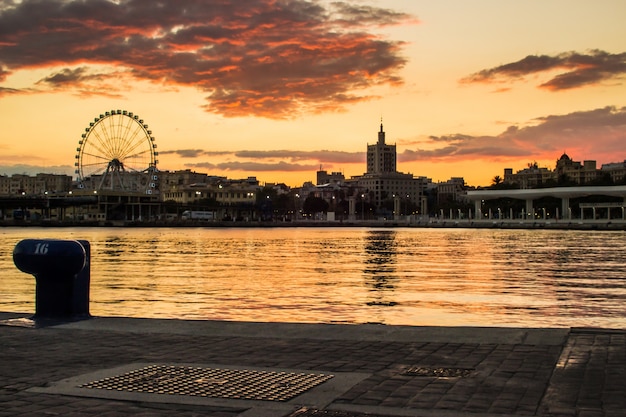 Port at Sunset with Ferris Wheel – Free Download