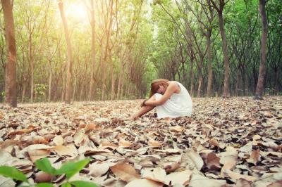 Woman Sitting with Head Resting on Knees – Free Download