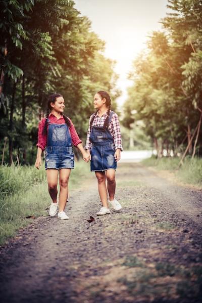 Girls Walking Along a Forest Road – Free to Download