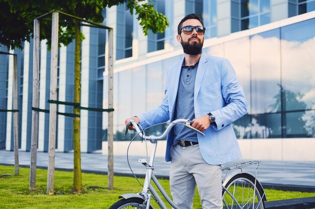 Luxury Bearded Male in Sunglasses Riding Bicycle in Downtown – Free Download